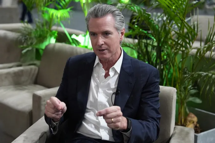 Newsom sells out the
US at latest hypocritical climate conference